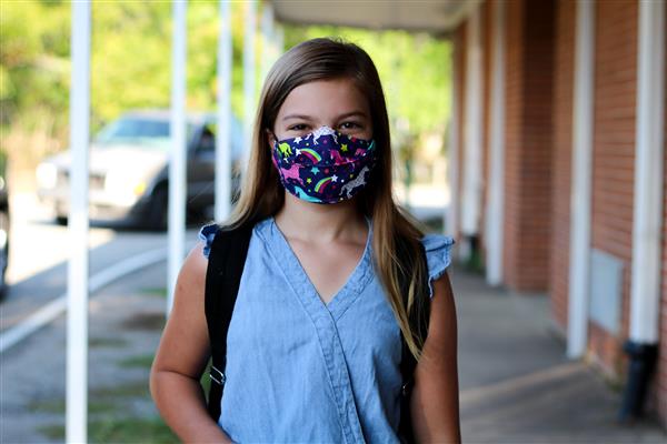 student smiles on first day of school